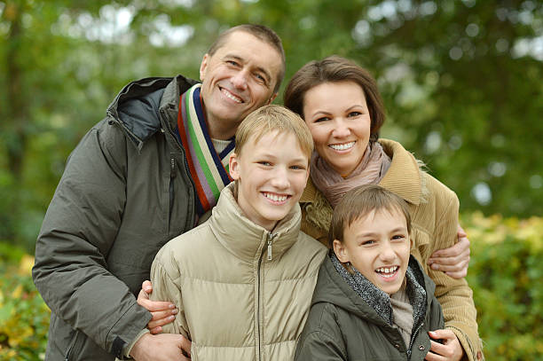 istock Family relaxing in autumn park 489303680