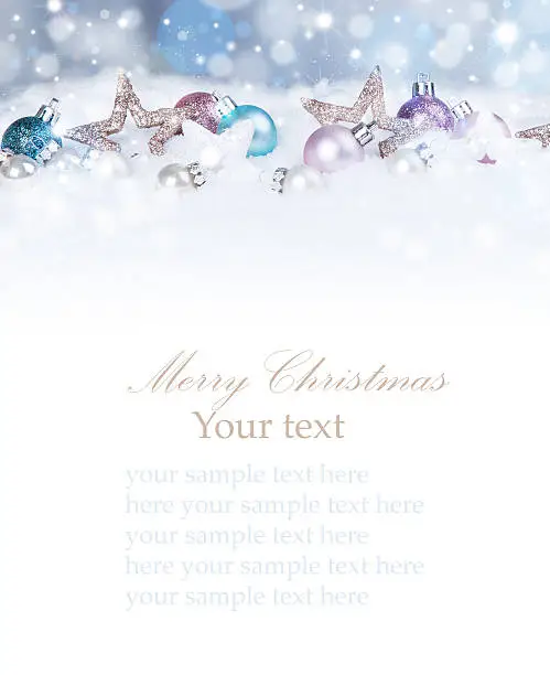 Christmas background with blue baubles,snow and snowflakes, free space for text. Christmas decoration.