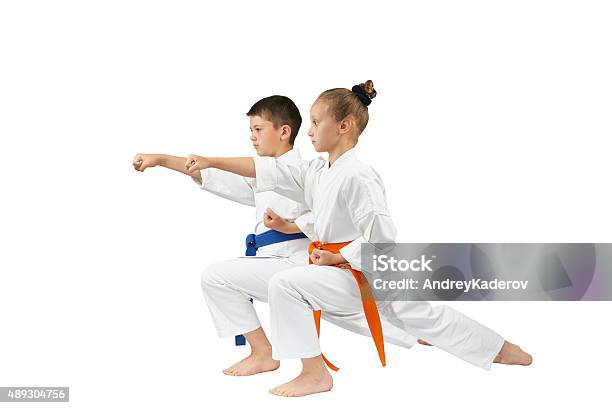 Children Are Beating The Blow Gyakutsuki In Racks Of Karate Stock Photo - Download Image Now