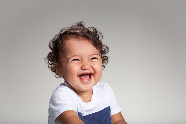 Ethnic Baby Mixed baby posing in studio. grimacing photos stock pictures, royalty-free photos & images