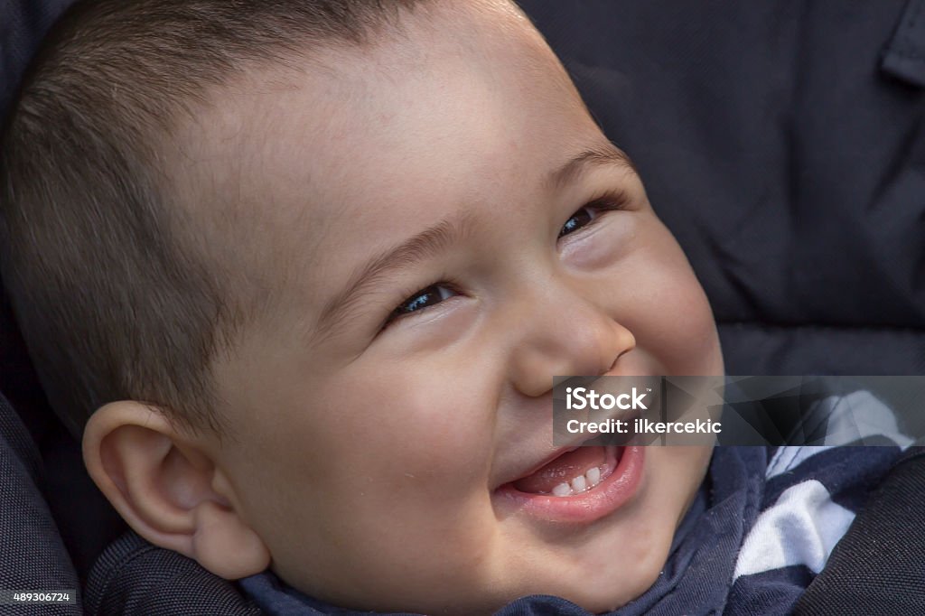 Smiling Chinese Asian child Happy child who is smiling with his mother in the baby mall 2015 Stock Photo