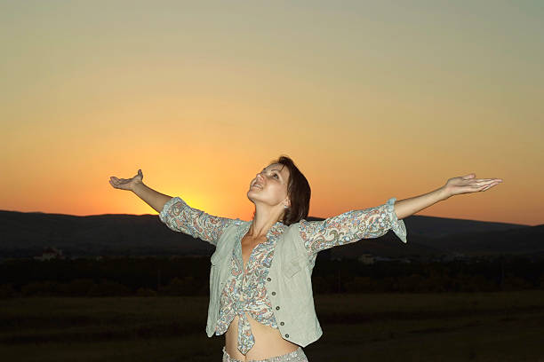 istock Beautiful nice woman meets sunset 489307634
