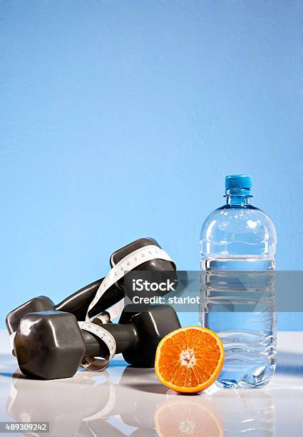 Oranges Weights And Bottлѓe Of Water Stock Photo - Download Image Now - 2015, Anaerobic Exercise, Antioxidant