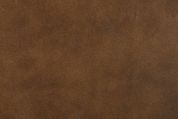istock Textured background of genuine dull brown leather. 489310802