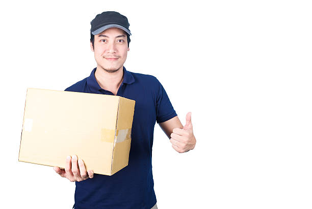 istock Smiling handsome asian delivery man giving and carrying parcel 489310814
