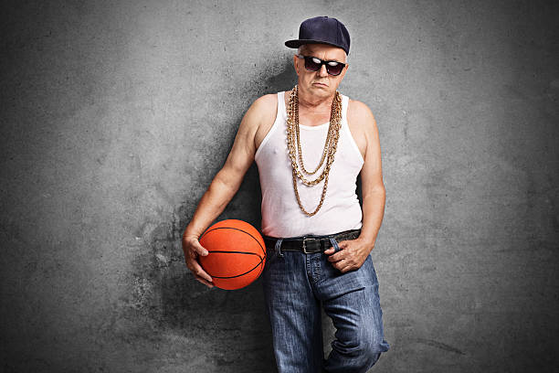 istock Sullen senior rapper holding a basketball 489311158