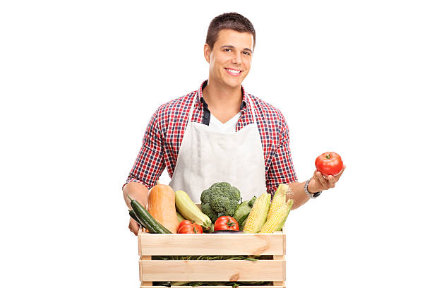 istock Young chef posing with crate full of vegetables 489312274