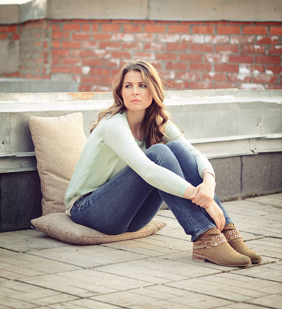 istock beautiful blonde woman sad 489315294