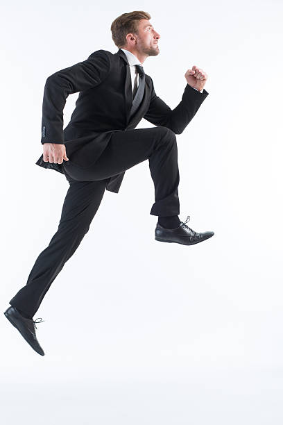 istock Businessman running up imaginative stairs 489316244