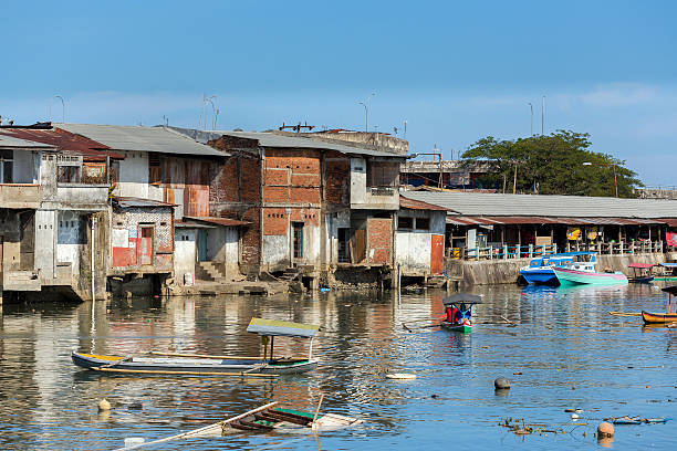 istock Straw poor houses by the river 489316586