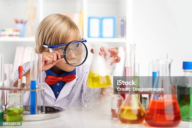 Examining Fuming Acid Stock Photo - Download Image Now - Child, Chemistry, Chemistry Class