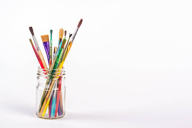 istock paints brushes in a glass isolated 489339078