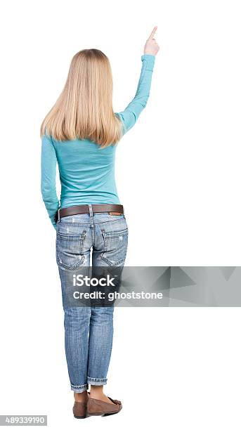 Back View Of Pointing Woman Beautiful Blonde Girl Rear View Stock Photo - Download Image Now