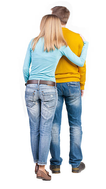 istock Back view of young embracing couple 489339498