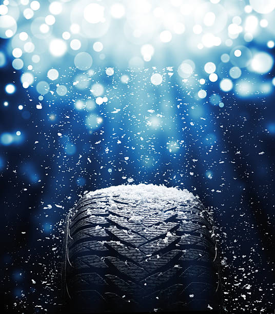 New tire during snowstorm stock photo