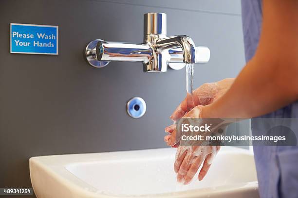 Close Up Of Medical Staff Washing Hands Stock Photo - Download Image Now - Washing Hands, Hospital, Doctor