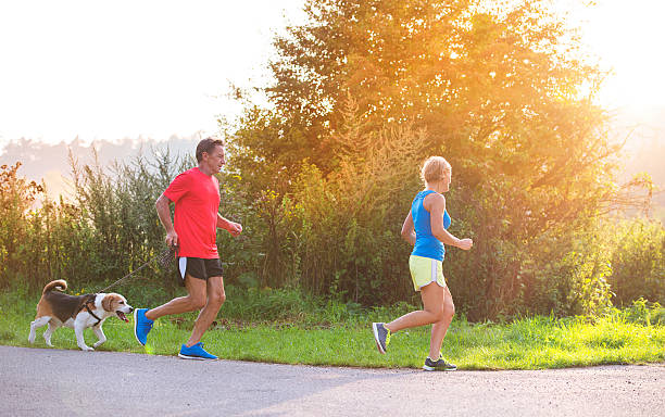 istock Senior couple running 489342114