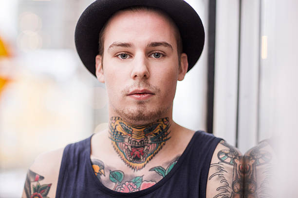 istock Stylish tattooed man outdoors 489342764