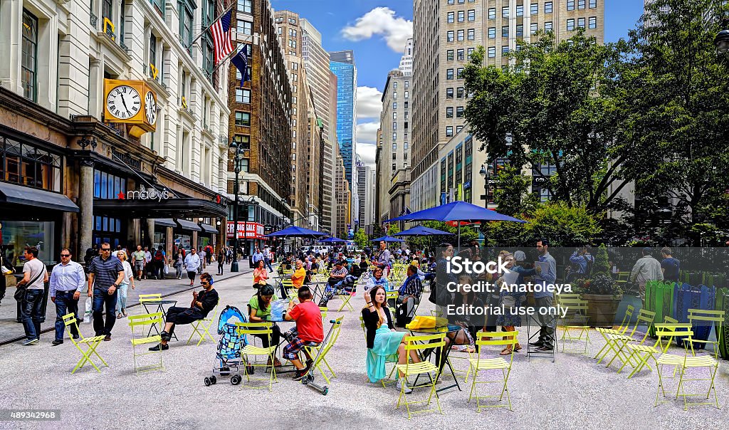 Outside Macy's, NYC Manhattan, NY, U.S.A - June 5th, 2013: image taken outside Macy's departmental store on a sunny afternoon in front of a seating area.  2015 Stock Photo