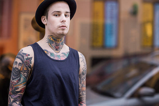 istock Confident tattooed man standing outdoors 489343028