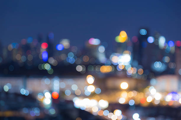 istock Blurred bokeh city light background at night 489343580