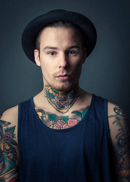 Confident And Handsome Male Fashion Model With Tattoos On Neck Stock  Photos, Pictures & Royalty-Free Images - iStock