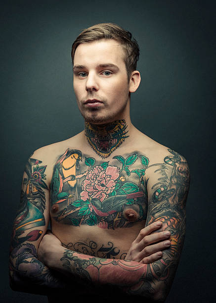 istock Shirtless tattooed man with arms crossed 489344934