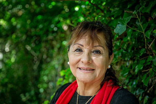 istock Vivacious mature smiling hispanic woman portrait 489345398