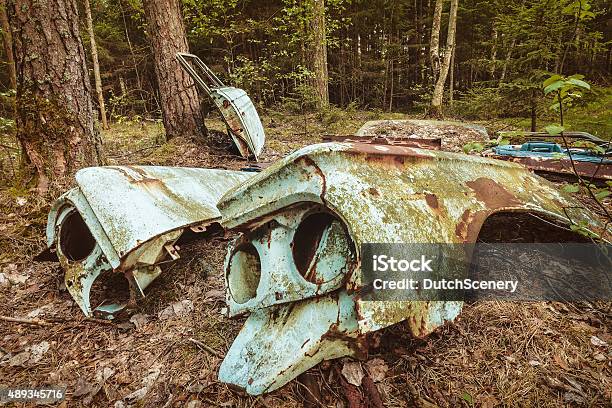 Old Rusted Scrap Car In A Forest Stock Photo - Download Image Now - 2015, Abandoned, Antique