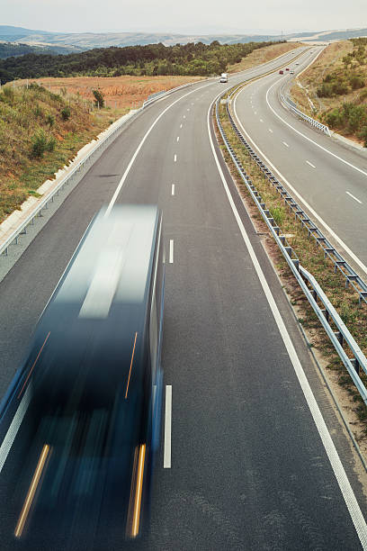 istock Blurred truck on a highway 489345750