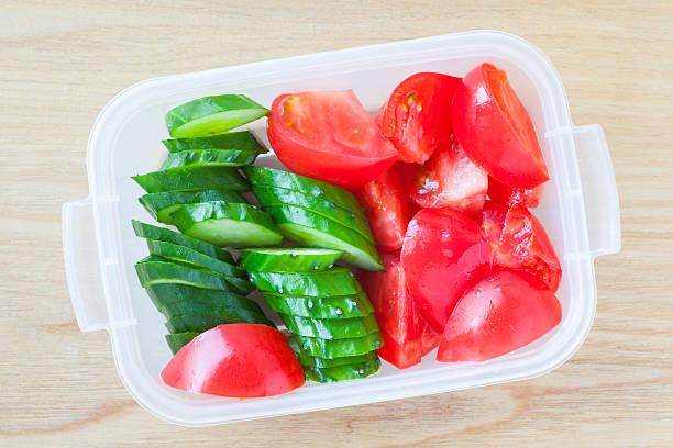 istock Slice cucumber  and slice tomato in plastic lunch box 489345756