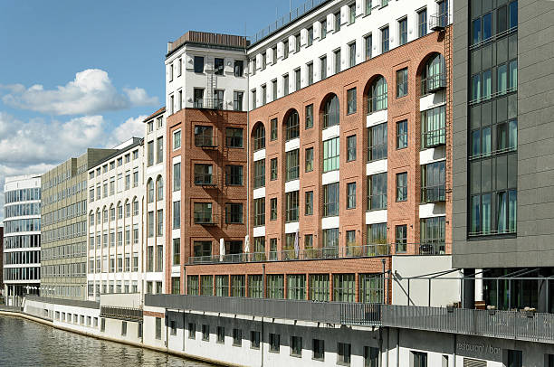 Spreeforum Old buildings and new buildings on the Spree in Berlin-Moabit. Industrial architecture and office architecture on the waterfront. moabit stock pictures, royalty-free photos & images