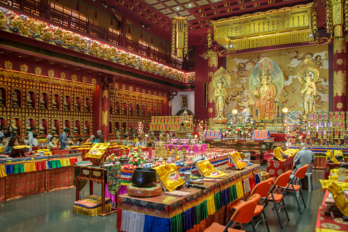 Singapore, Singapore - May 7, 2015: Interior of the Buddha Tooth Relic Temple, the most famous buddhist temple of Chinatow in Singapore