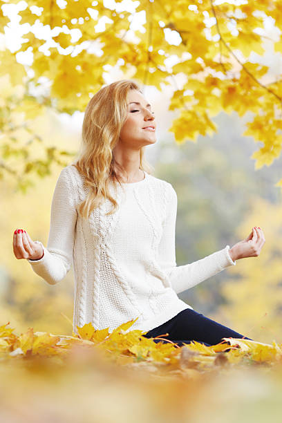 istock Autumn yoga 489347852
