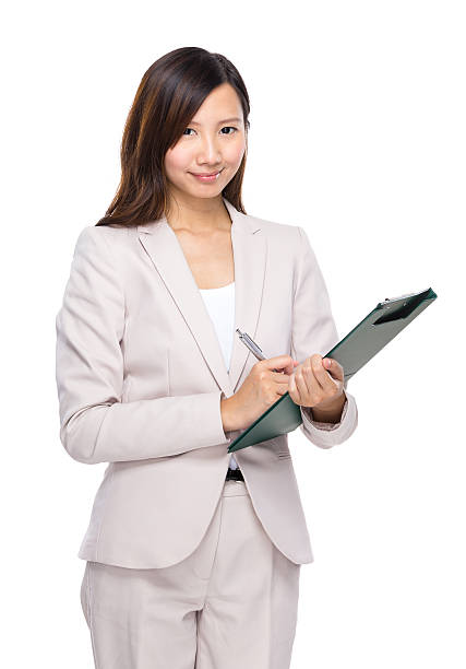 istock Asian businesswoman write on clipboard 489350052