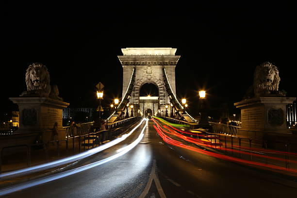 Budapest chain bridge at night Various views of the beautiful city of Budapest in Hungary, Europe. Images include the chain bridge, shoes on the Danube memorial, Hungarian Parliment building Refugees camping under Keleti Railway Station and Buda Castle danube river stock pictures, royalty-free photos & images