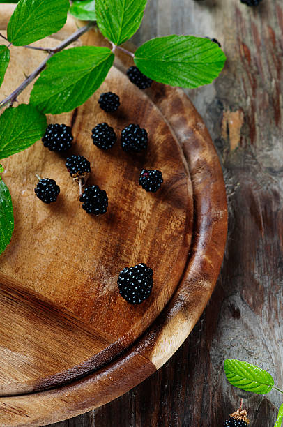 istock Fresh sweet blackberry on the wooden table 489351148
