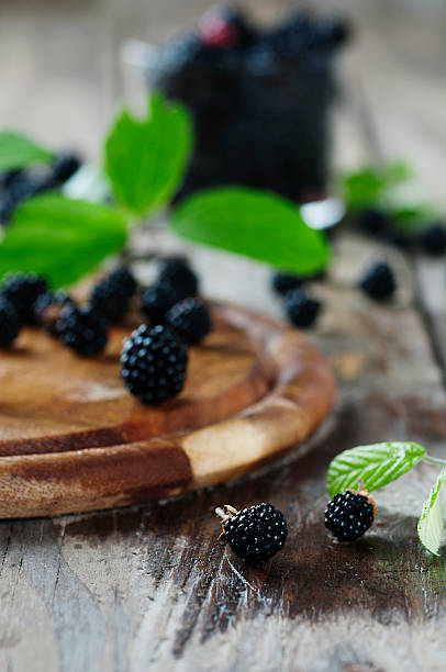istock Fresh sweet blackberry on the wooden table 489351502