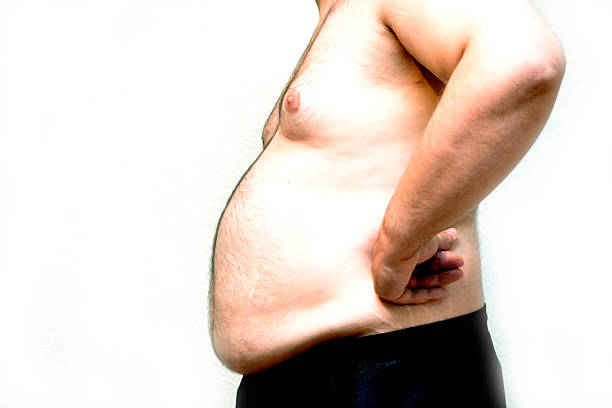 istock Obese akimbo young man on a white background 489351978
