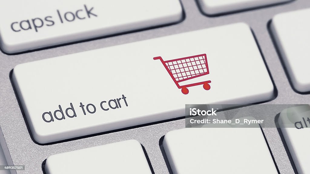 Add to Cart Keyboard Button with Red Shopping Cart An extreme close-up of a keyboard, focused on the shift key which now says “add to cart” and has a red icon of a shopping cart. ***note to the reviewer: The  icon is my 100% original vector. Store Stock Photo