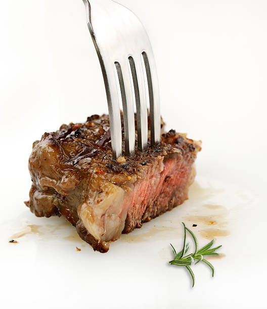 istock Piece Of Red  Meat Steak On A Fork 489357515