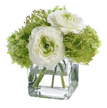 A small mixed cream and green colored bouquet in a glass cube. This arrangement was shot against a bright white background. Extremely high quality faux flowers.