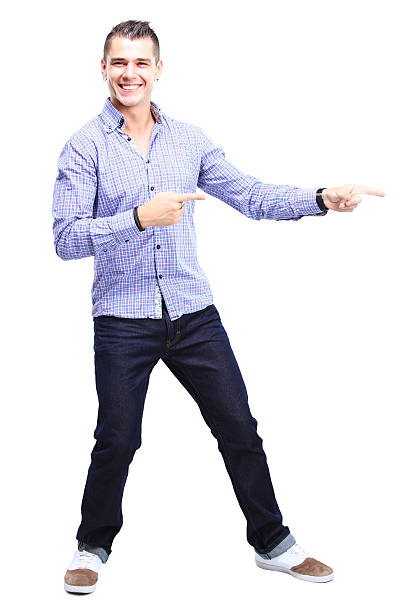 istock Happy smiling young man presenting and showing your text 489358553