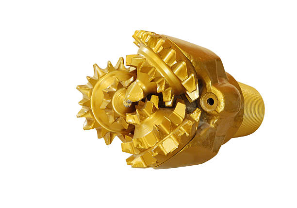 istock Golden color Tricone rock drilling bit isolated on white 489358839
