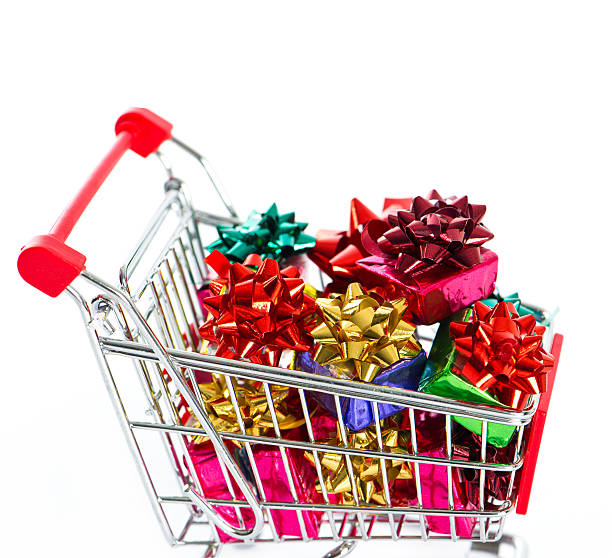 istock Shopping cart with colorful christmas gift boxes 489359543