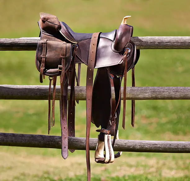 Shot of a saddle on a fence