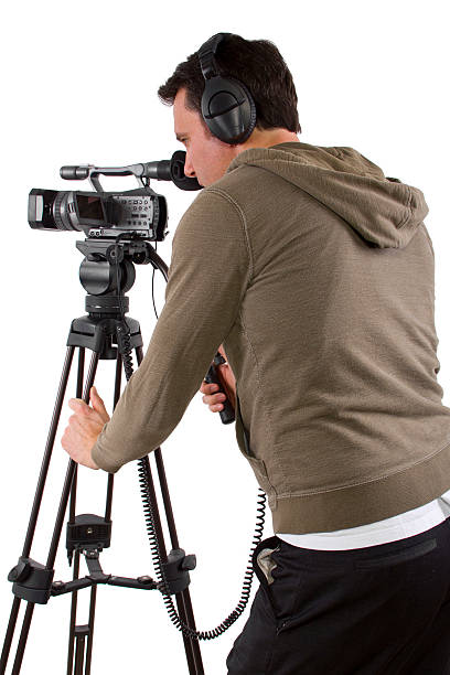 istock Camera Man Wearing Headphones with a Camera and Tripod 489362361