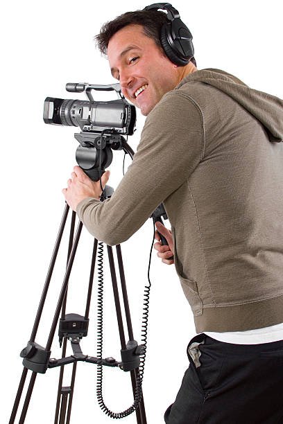 istock Camera Man Wearing Headphones with a Camera and Tripod 489362379