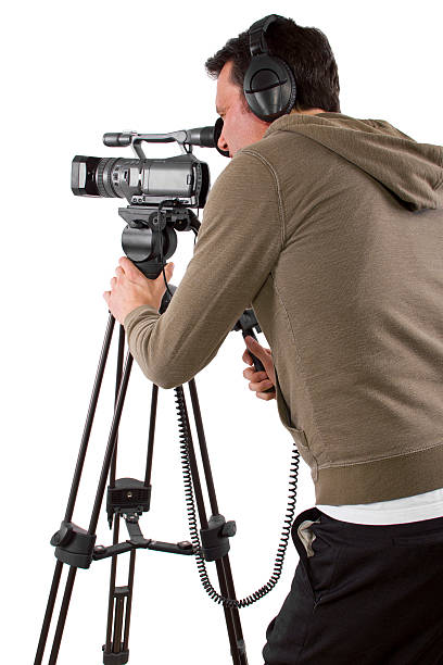istock Camera Man Wearing Headphones with a Camera and Tripod 489362387