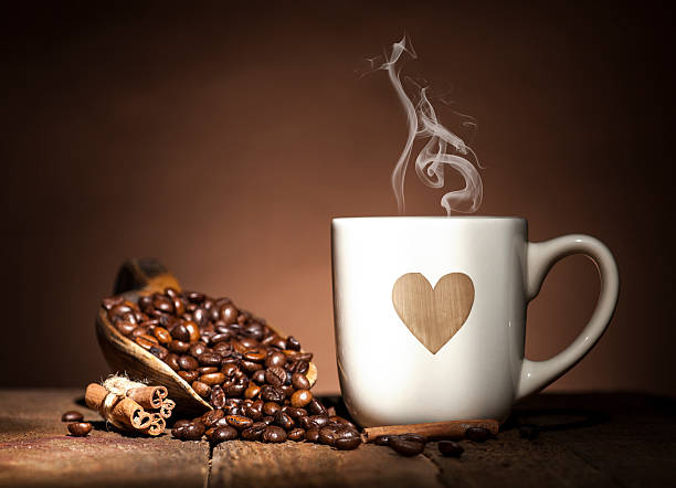 istock White cup with heart and coffee beans 489377086
